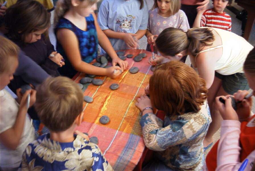 group of children with rocks